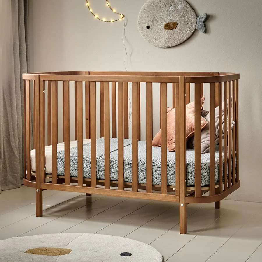 Cocoon oval cot · walnut finish